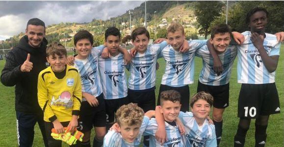 Paul Eymard debout tout à droite avec son équipe U13 du Puy Foot.